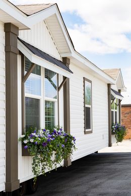 The SOUTHERN CHARM Exterior. This Manufactured Mobile Home features 3 bedrooms and 2 baths.