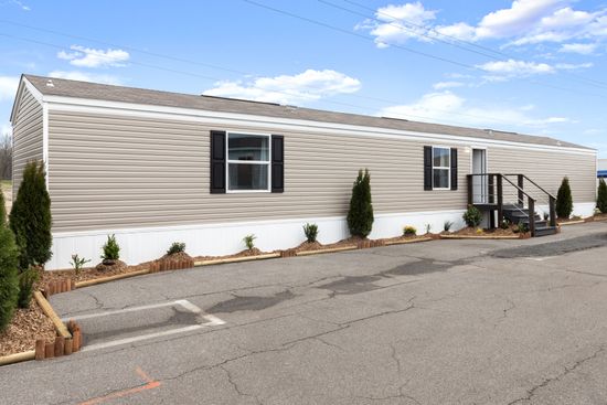 The VICTORY PLUS Exterior. This Manufactured Mobile Home features 3 bedrooms and 2 baths.