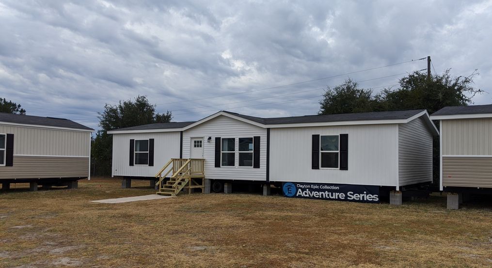 The RIO with white Colonial Exterior. This Manufactured Mobile Home features 3 bedrooms and 2 baths.