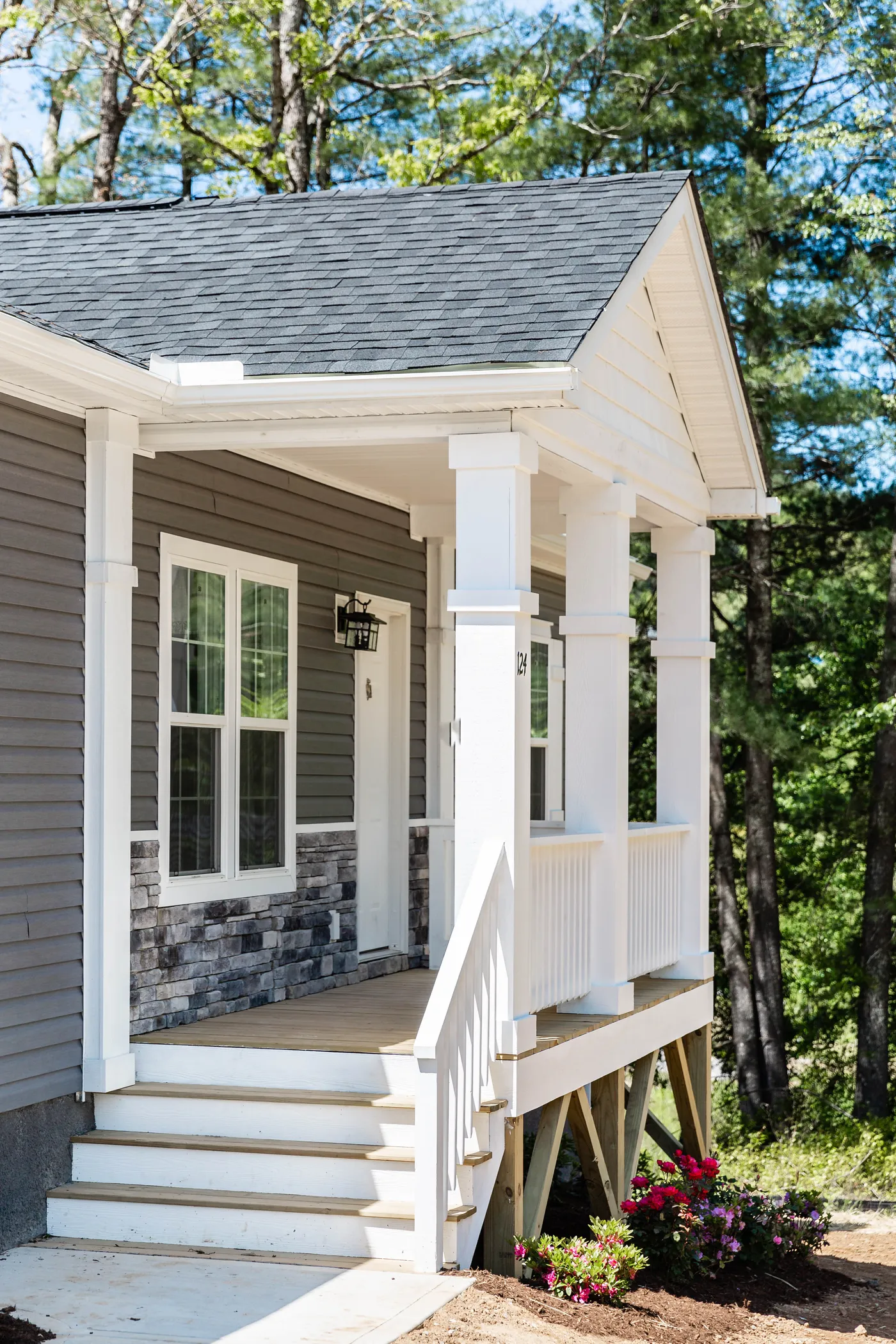 The THE ELITE 60 Exterior. This Manufactured Mobile Home features 4 bedrooms and 2 baths.