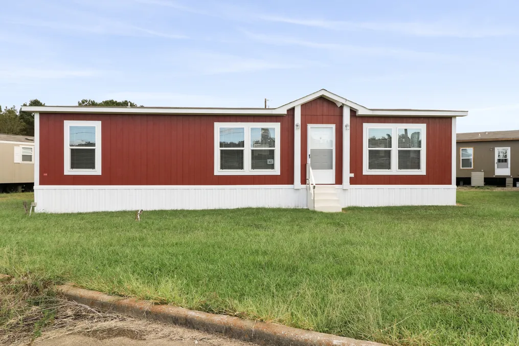 The THE REAL DEAL Exterior. This Manufactured Mobile Home features 3 bedrooms and 2 baths.