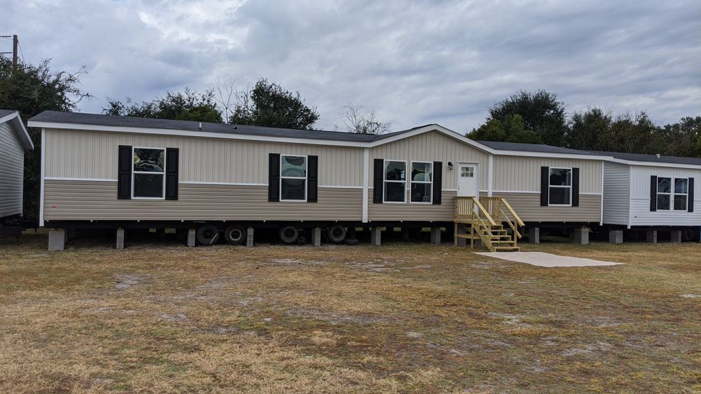 The MOROCCO Clay/Mist Southern Ranch Exterior. This Manufactured Mobile Home features 4 bedrooms and 2 baths.