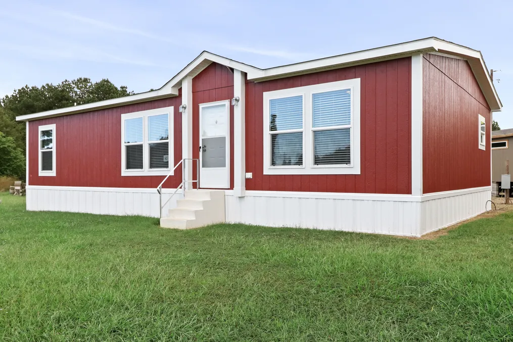 The THE REAL DEAL Exterior. This Manufactured Mobile Home features 3 bedrooms and 2 baths.