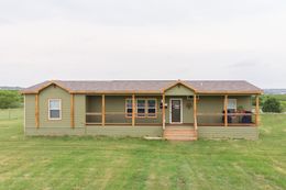The THE CABIN Exterior. This Manufactured Mobile Home features 3 bedrooms and 2 baths.