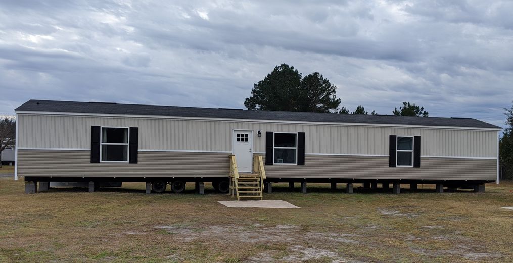 The SYDNEY with Clay/Mist Southern Ranch Exterior. This Manufactured Mobile Home features 3 bedrooms and 2 baths.