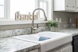 The 4607 ROCKETEER 7 7628 Features white farm sink. This Manufactured Mobile Home features 4 bedrooms and 2 baths.