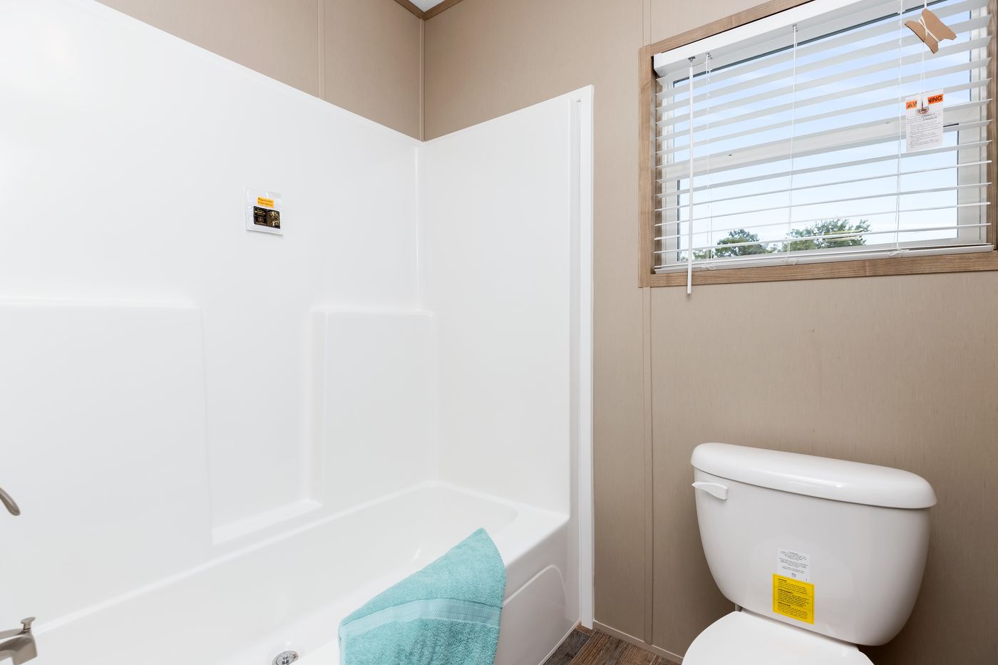The FARMHOUSE FLEX Guest Bathroom. This Manufactured Mobile Home features 3 bedrooms and 2.5 baths.