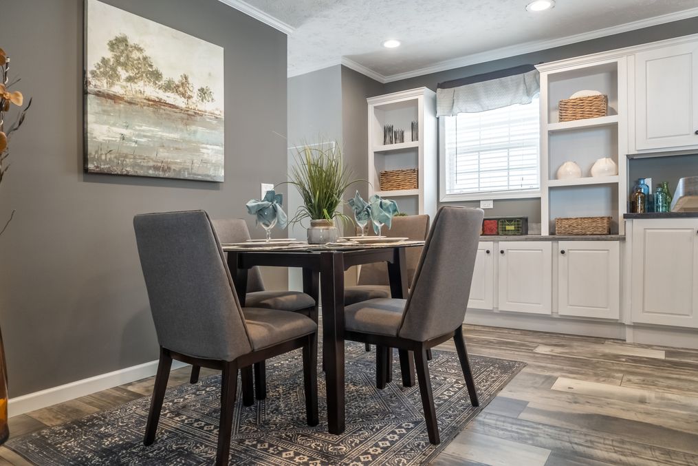 The 6110 ROCKETEER 4428 Dining Room. This Manufactured Mobile Home features 3 bedrooms and 2 baths.