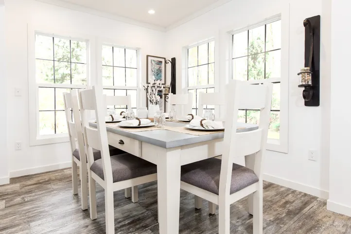 The THE LULABELLE Dining Room. This Manufactured Mobile Home features 4 bedrooms and 3 baths.