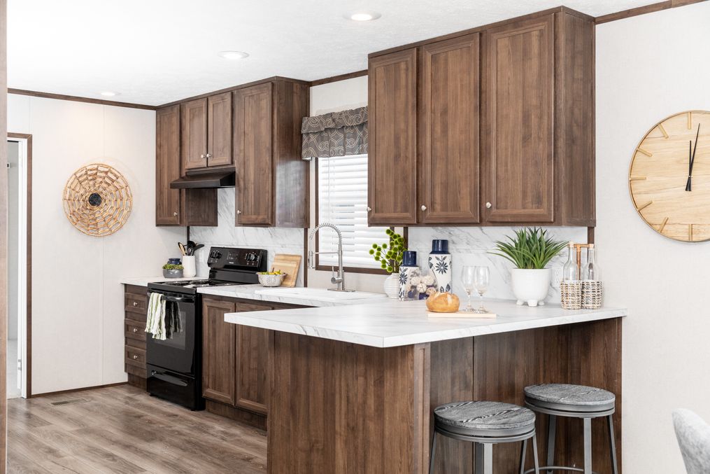 The THE REFLECTIONS Kitchen. This Manufactured Mobile Home features 3 bedrooms and 2 baths.