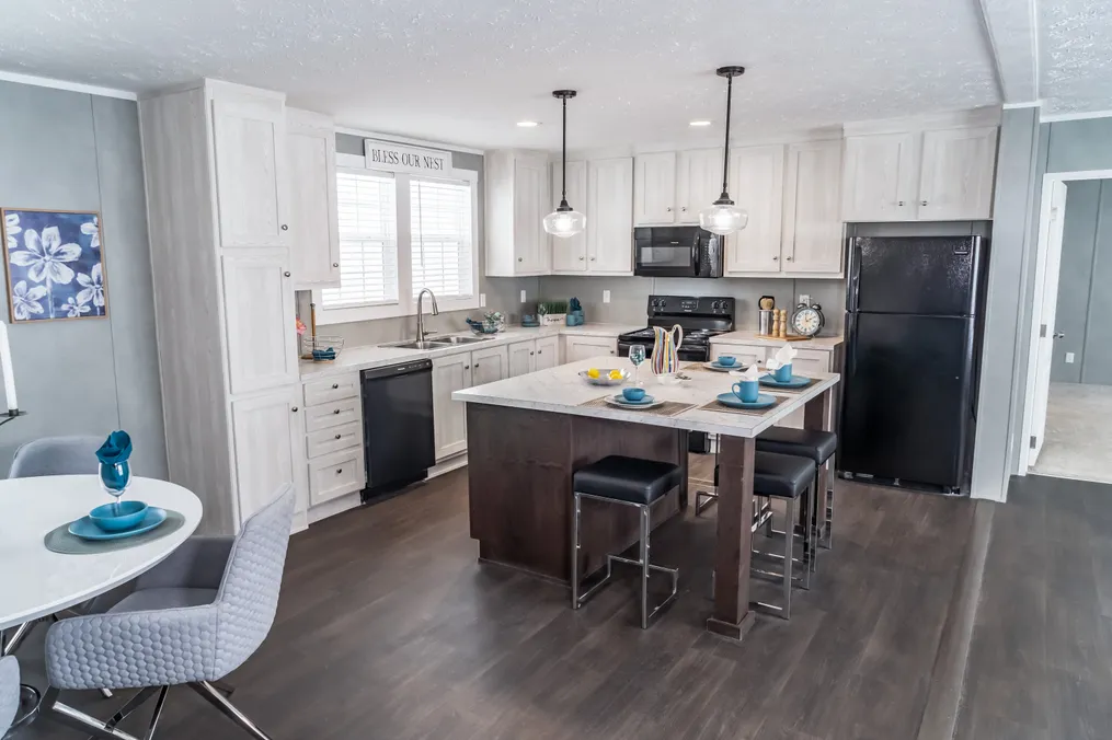 The ULTRA BREEZE 76 Kitchen. This Manufactured Mobile Home features 4 bedrooms and 2 baths.