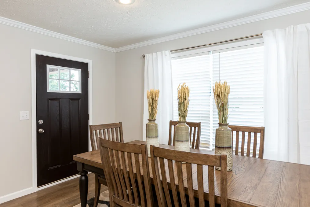 The KEENELAND Dining Area. This Manufactured Mobile Home features 3 bedrooms and 2 baths.