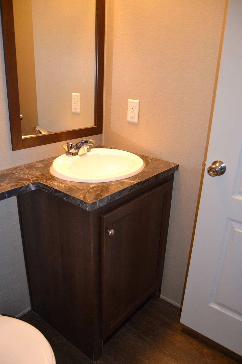 The MAPLE 7014-660 Primary Bathroom. This Manufactured Mobile Home features 3 bedrooms and 2 baths.