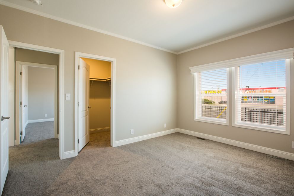 The EDGEWOOD Guest Bedroom. This Manufactured Mobile Home features 3 bedrooms and 2 baths.