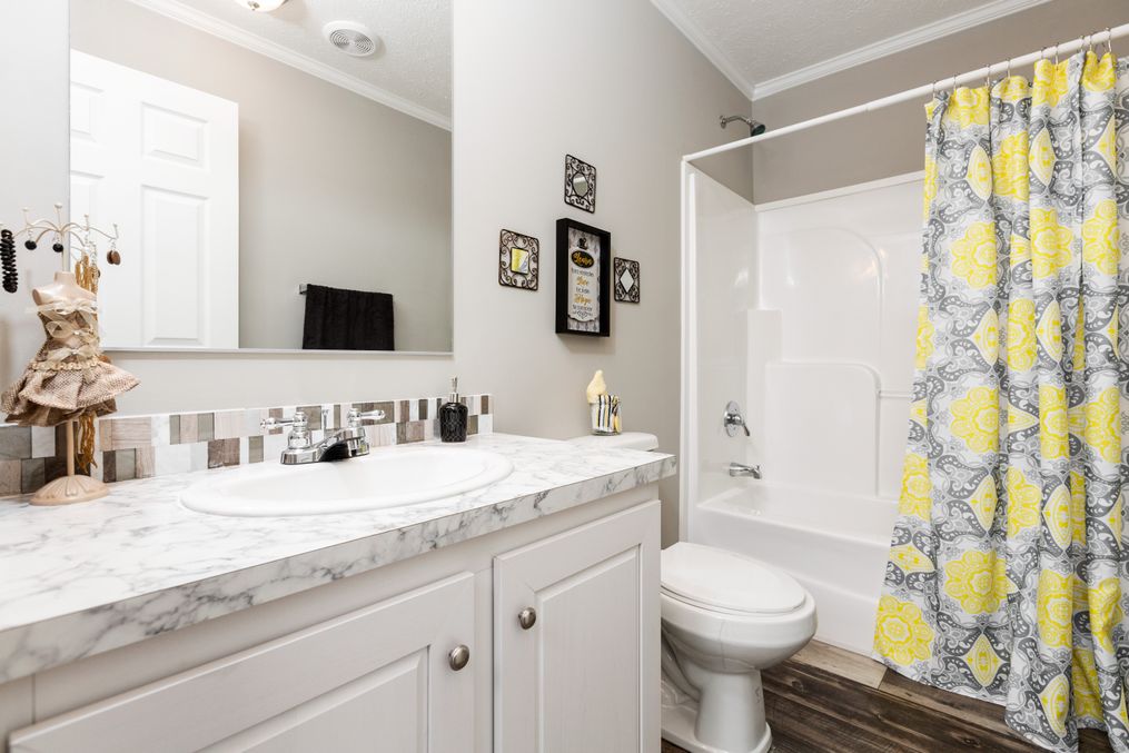 The 5602 ENTERPRISE 2 7028 Guest Bathroom. This Manufactured Mobile Home features 4 bedrooms and 2 baths.