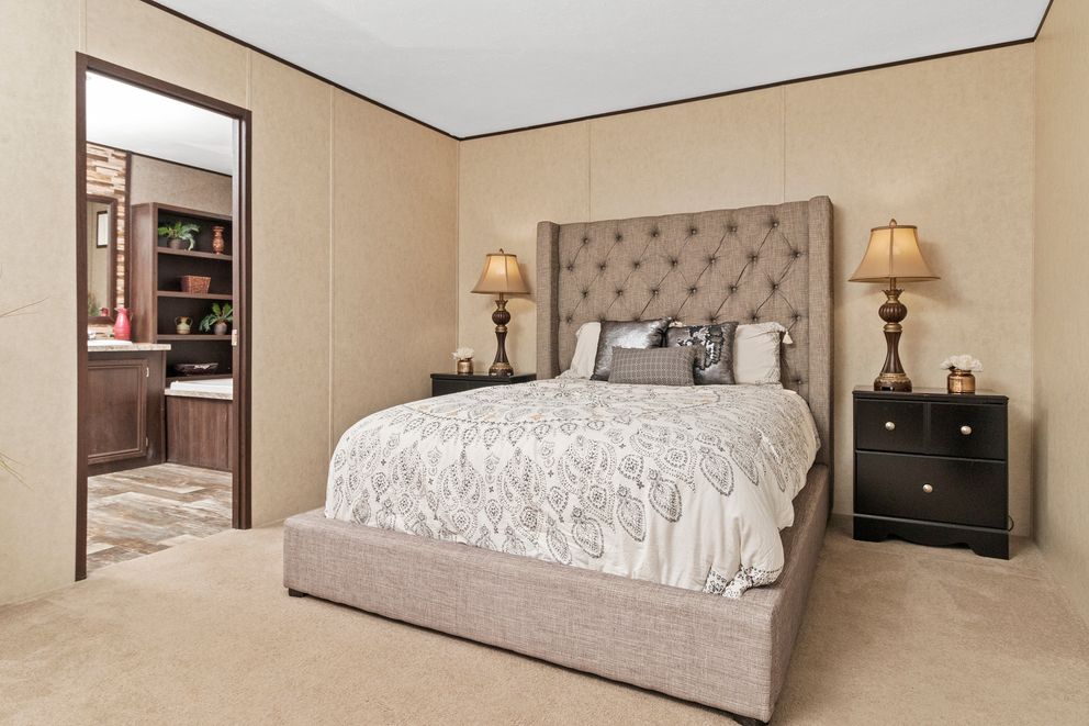 The THE PARKSIDE Primary Bedroom. This Manufactured Mobile Home features 3 bedrooms and 2 baths.