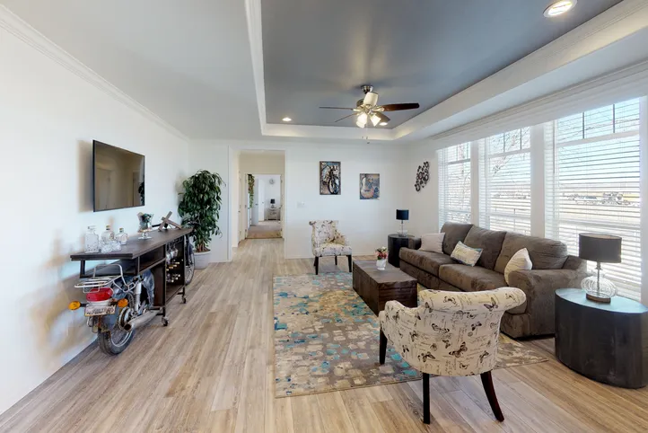 The SUM3068A Living Room. This Manufactured Mobile Home features 3 bedrooms and 2 baths.