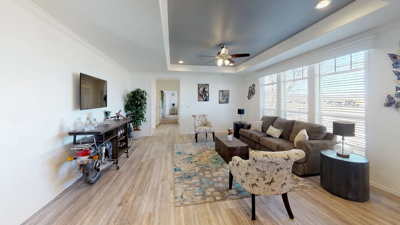 The SUM3068A Living Room. This Manufactured Mobile Home features 3 bedrooms and 2 baths.
