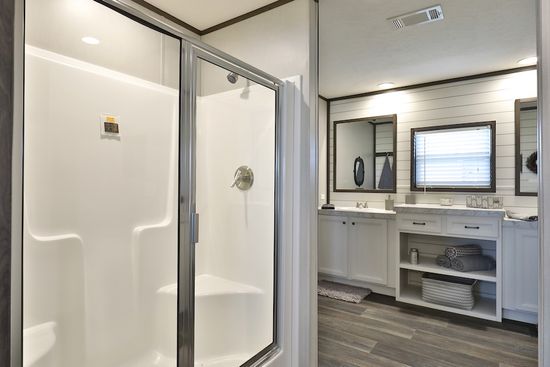 The BREEZE FARMHOUSE Primary Bathroom. This Manufactured Mobile Home features 3 bedrooms and 2 baths.