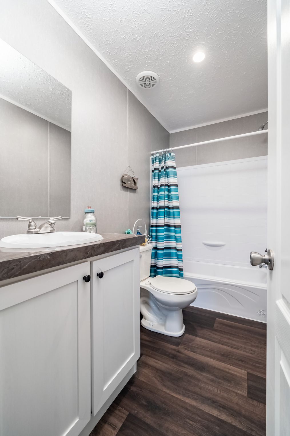 The THE EAGLE 76 Guest Bathroom. This Manufactured Mobile Home features 5 bedrooms and 2 baths.