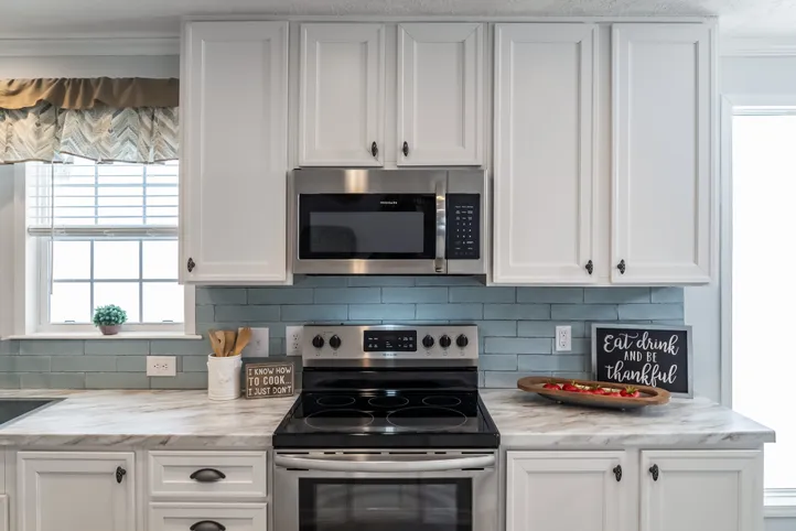 The THE LEAHY Kitchen. This Manufactured Mobile Home features 4 bedrooms and 2 baths.
