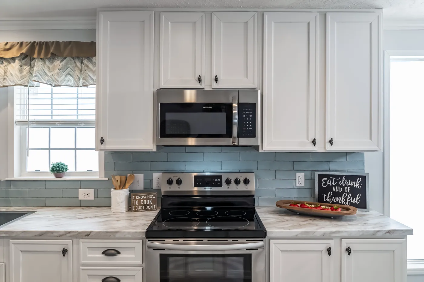 The THE LEAHY Kitchen. This Manufactured Mobile Home features 4 bedrooms and 2 baths.