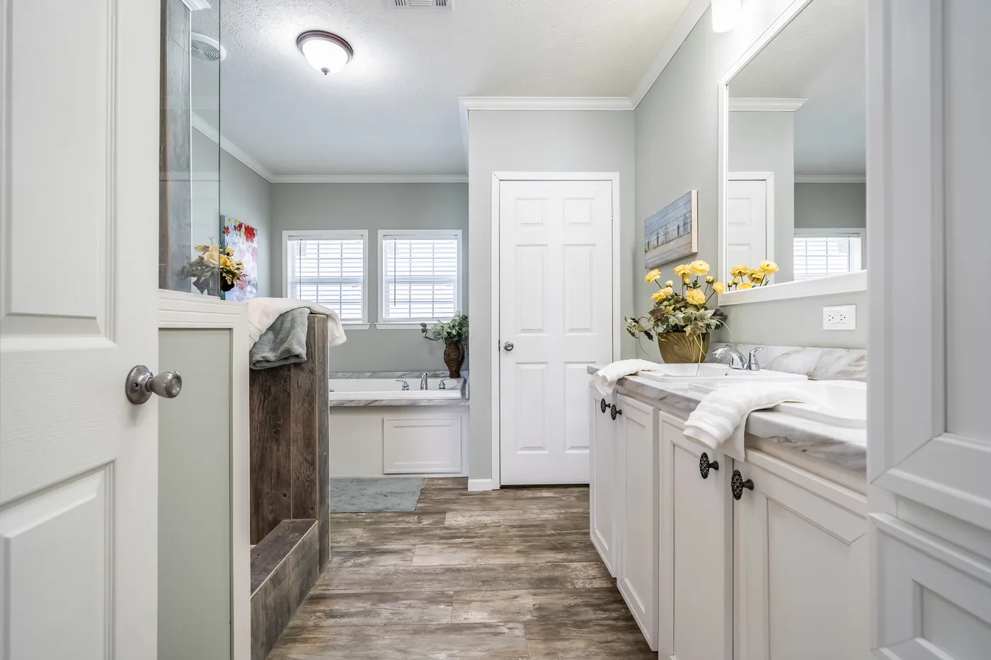 The THE INGRAM Primary Bathroom. This Manufactured Mobile Home features 3 bedrooms and 2 baths.