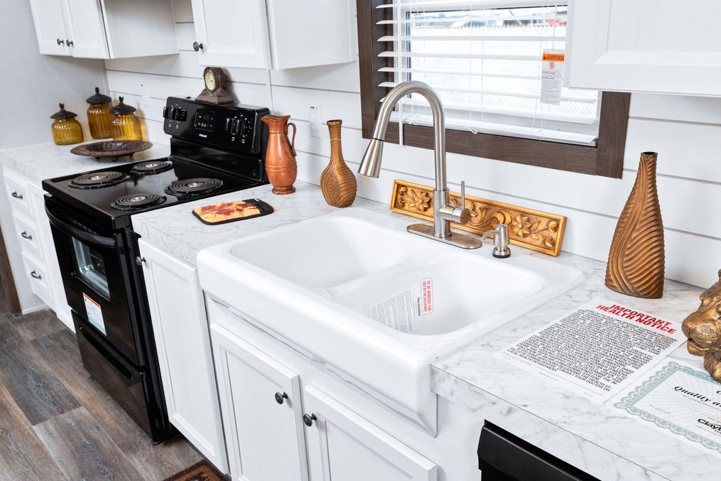 The THE CHOICE Kitchen. This Manufactured Mobile Home features 4 bedrooms and 2 baths.
