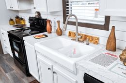 The THE CHOICE Kitchen. This Manufactured Mobile Home features 4 bedrooms and 2 baths.