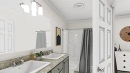 The 905  ADVANTAGE PLUS 6016 Master Bathroom. This Manufactured Mobile Home features 2 bedrooms and 2 baths.