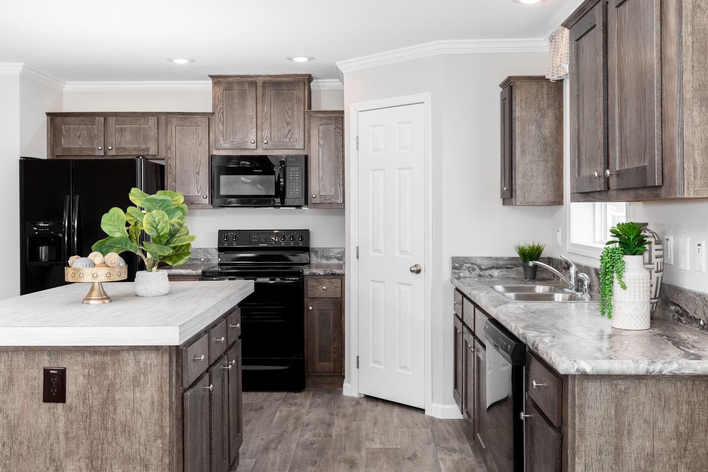The THE VILLETTE Kitchen. This Manufactured Mobile Home features 3 bedrooms and 2 baths.