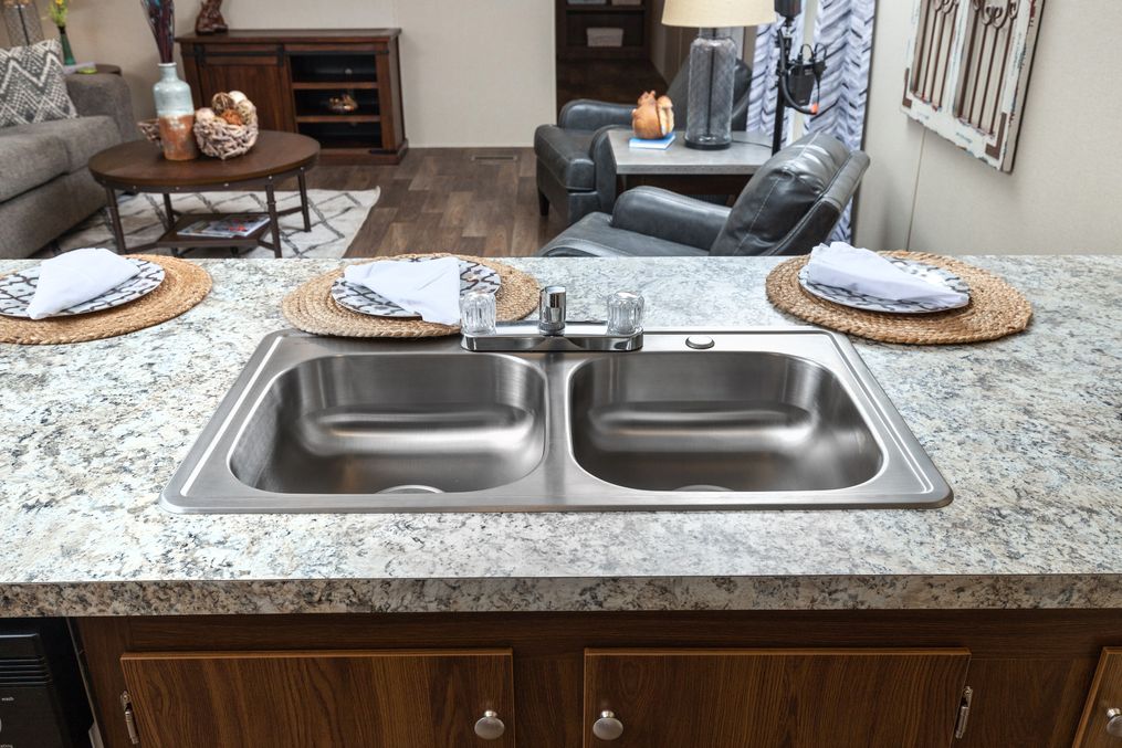 The VICTORY PLUS Kitchen. This Manufactured Mobile Home features 3 bedrooms and 2 baths.