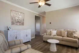 The EDGEWOOD Living Room. This Manufactured Mobile Home features 3 bedrooms and 2 baths.