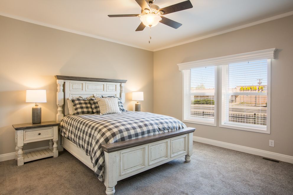 The EDGEWOOD Primary Bedroom. This Manufactured Mobile Home features 3 bedrooms and 2 baths.