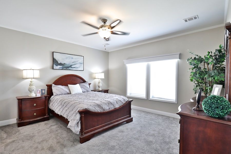 The EDGEWOOD Primary Bedroom. This Manufactured Mobile Home features 3 bedrooms and 2 baths.