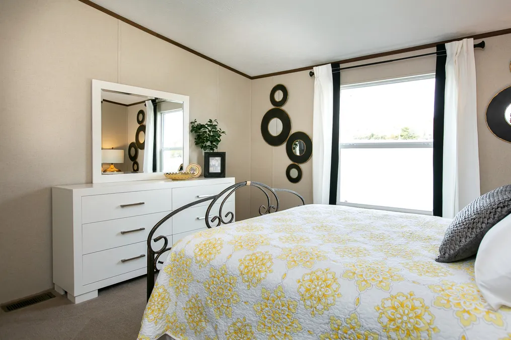 The TRIUMPH Guest Bedroom. This Manufactured Mobile Home features 5 bedrooms and 3 baths.