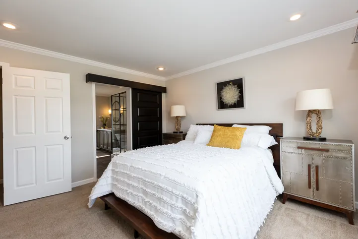 The THE FREEDOM SOHO Primary Bedroom. This Manufactured Mobile Home features 3 bedrooms and 2 baths.