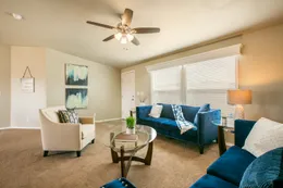 The THE WAVE Family Room. This Manufactured Mobile Home features 4 bedrooms and 2 baths.