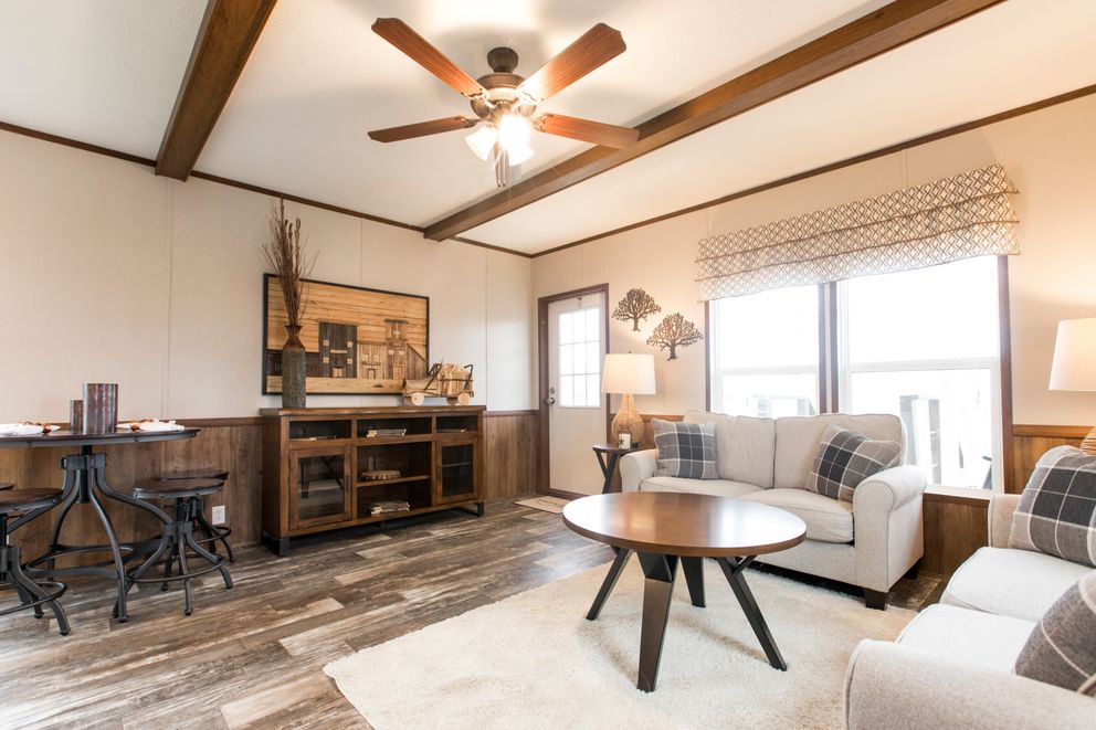 The THE LODGE Living Room. This Manufactured Mobile Home features 2 bedrooms and 2 baths.
