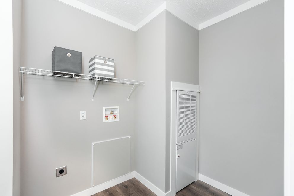 The 1440 CAROLINA 4BR BELLE Utility Room. This Manufactured Mobile Home features 4 bedrooms and 2 baths.