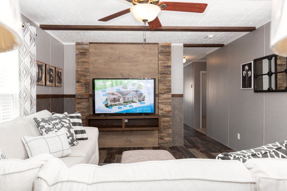 The TRADITION 76C Living Room. This Manufactured Mobile Home features 4 bedrooms and 2 baths.