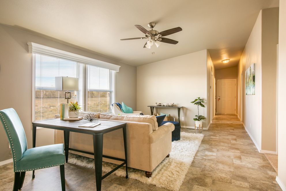 The THE WAVE Living Room. This Manufactured Mobile Home features 4 bedrooms and 2 baths.