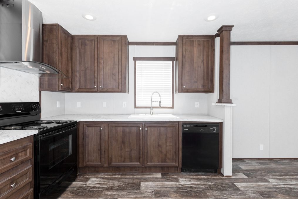 The THE POWERHOUSE Kitchen. This Manufactured Mobile Home features 3 bedrooms and 2 baths.