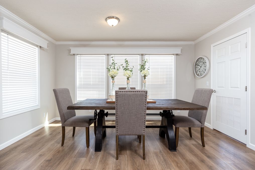 The REMINGTON Dining Area. This Manufactured Mobile Home features 3 bedrooms and 2 baths.