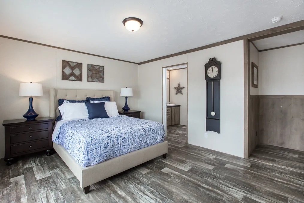 The THE BREEZE 2.5         CLAYTON Primary Bedroom. This Manufactured Mobile Home features 4 bedrooms and 2 baths.