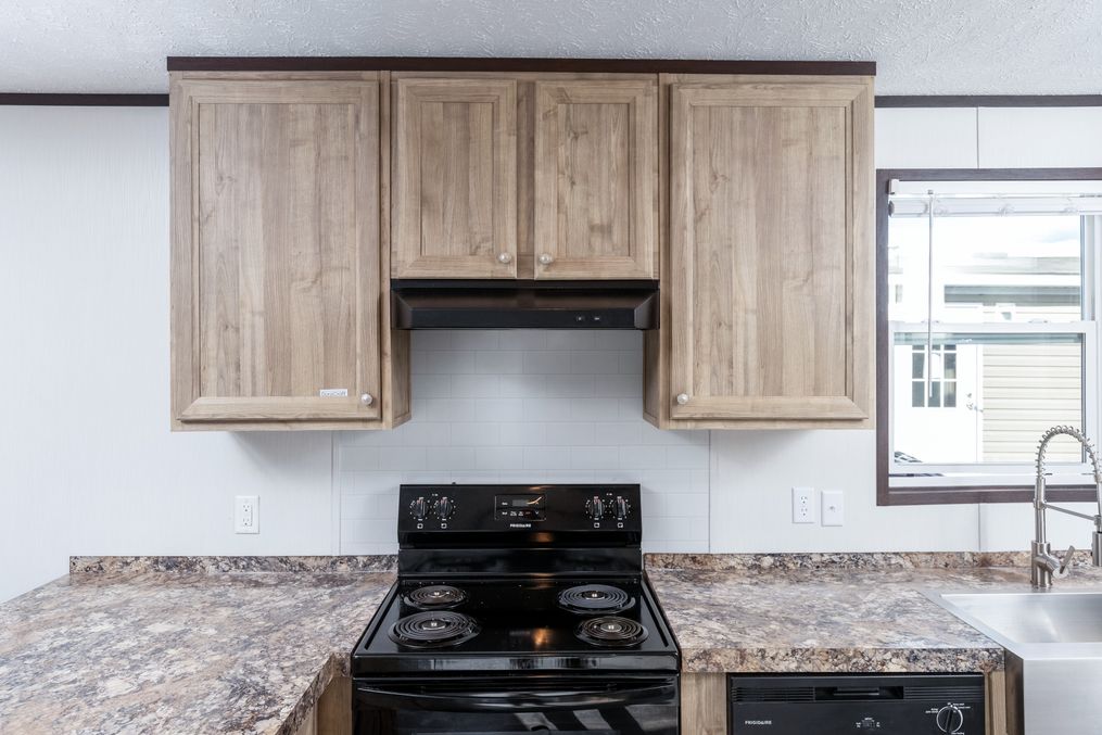 The THE ANNIVERSARY 16 Kitchen. This Manufactured Mobile Home features 3 bedrooms and 2 baths.