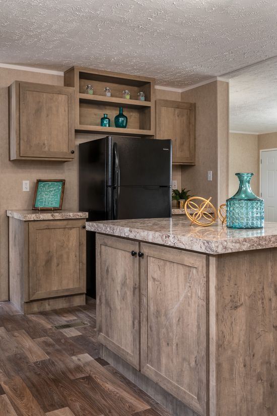 The THE EAGLE 60 Kitchen. This Manufactured Mobile Home features 3 bedrooms and 2 baths.