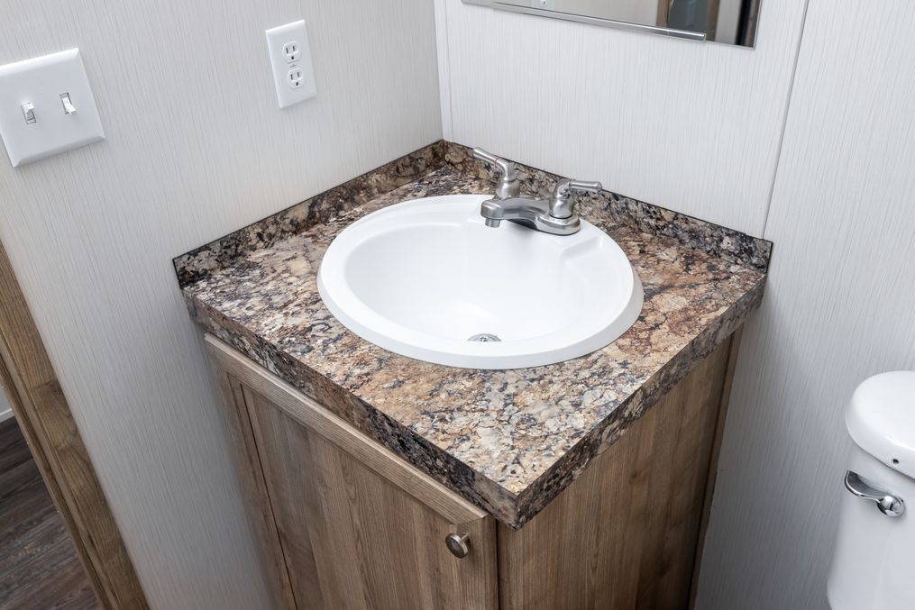 The THE ANNIVERSARY 16 Guest Bathroom. This Manufactured Mobile Home features 3 bedrooms and 2 baths.