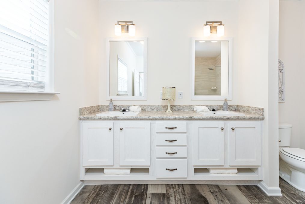 The 1714 HERITAGE Primary Bathroom. This Manufactured Mobile Home features 3 bedrooms and 2 baths.