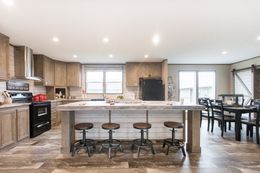 The THE CREEKWOOD Living Room. This Manufactured Mobile Home features 4 bedrooms and 2 baths.